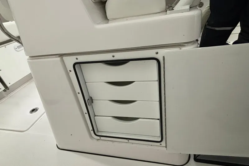 Slide: The Image of Storage drawers on a 2023 Everglades 285 Center Console boat interior. - 19