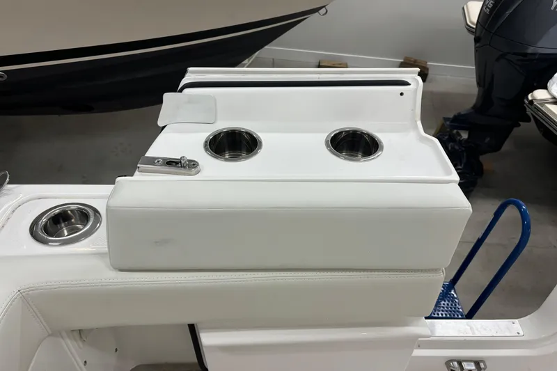 Slide: The Image of 2023 Everglades 285 Center Console boat interior with cup holders and seating. - 20