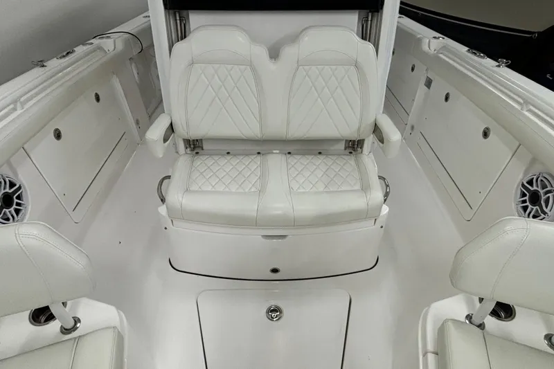 Slide: The Image of 2023 Everglades 285 Center Console interior with white seating and modern design. - 29