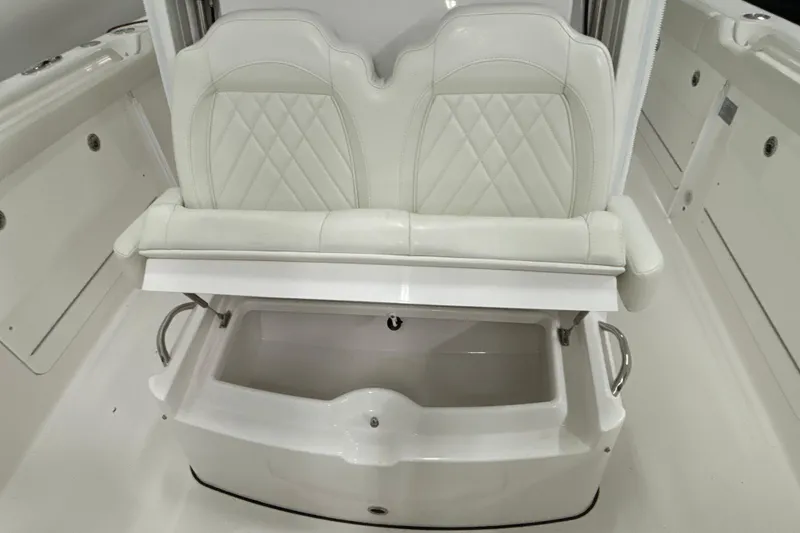 Slide: The Image of 2023 Everglades 285 Center Console boat seat with storage compartment, white upholstery. - 31