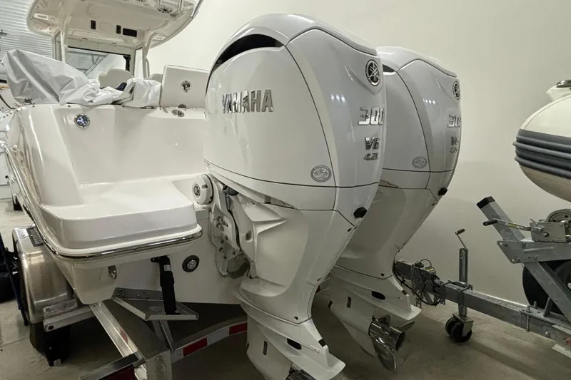 Slide: The Image of 2023 Everglades 285 Center Console with twin Yamaha 300 V6 outboard engines. - 36