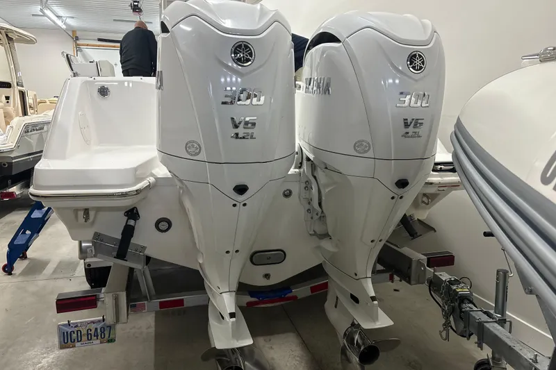 Slide: The Image of 2023 Everglades 285 Center Console with twin Yamaha 300 V6 outboard engines. - 38