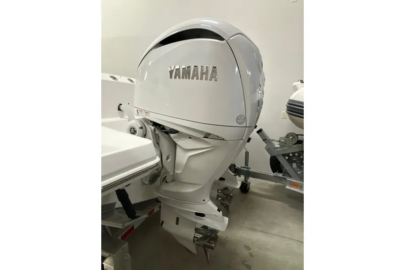 Slide: The Image of 2023 Everglades 285 Center Console with Yamaha outboard motor in a showroom. - 39