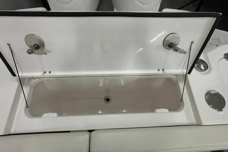 Slide: The Image of Open storage compartment on 2023 Everglades 285 Center Console boat. - 6