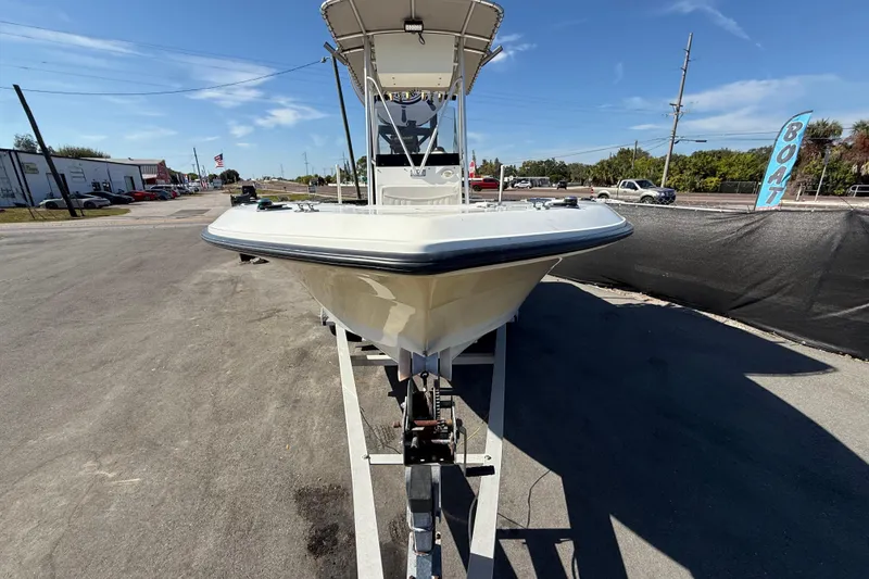 Slide: The Image of 2006 Hydra-Sports Lightning 212 CC boat on trailer, parked outdoors under clear sky. - 10