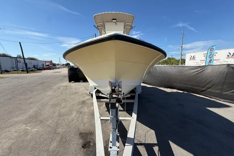 Slide: The Image of 2006 Hydra-Sports Lightning 212 CC boat on trailer, parked outdoors under clear blue sky. - 11