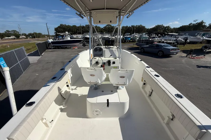 Slide: The Image of 2006 Hydra-Sports Lightning 212 CC boat interior with steering console and seating. - 16