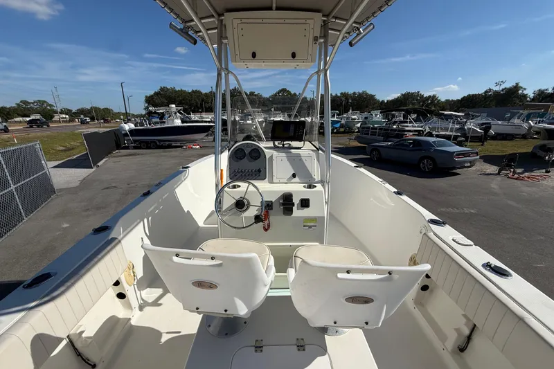 Slide: The Image of 2006 Hydra-Sports Lightning 212 CC boat interior with steering console and seating. - 18