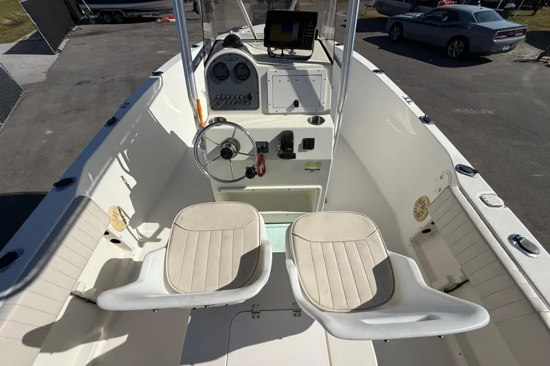 Slide: The Image of 2006 Hydra-Sports Lightning 212 CC boat interior with steering wheel and seating. - 24