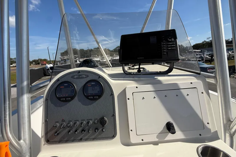 Slide: The Image of 2006 Hydra-Sports Lightning 212 CC boat dashboard with gauges and navigation system. - 27