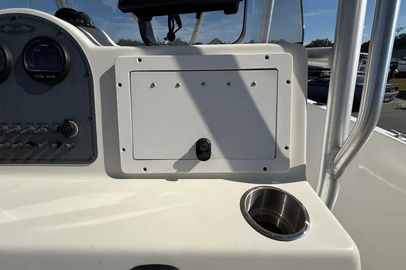 Slide: The Image of 2006 Hydra-Sports Lightning 212 CC dashboard with gauges and cup holder. - 32