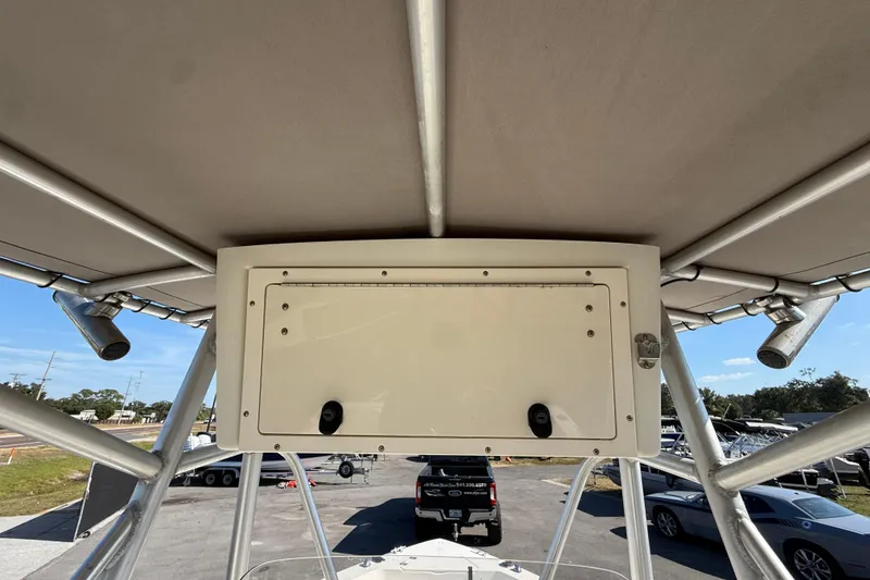 Slide: The Image of 2006 Hydra-Sports Lightning 212 CC boat with T-top and storage compartment. - 35