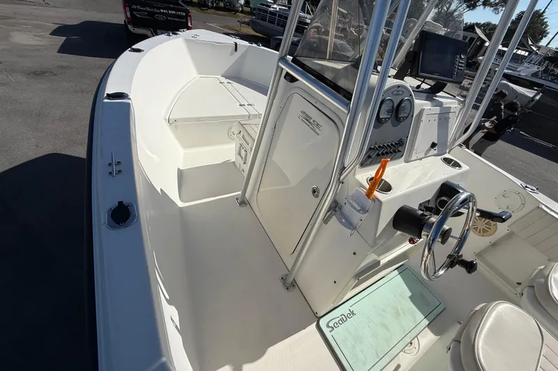 Slide: The Image of 2006 Hydra-Sports Lightning 212 CC boat interior with steering console and seating. - 38