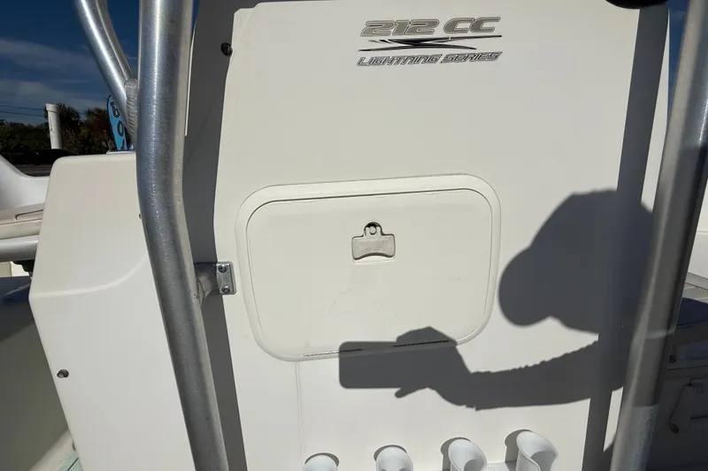 Slide: The Image of 2006 Hydra-Sports Lightning 212 CC boat console with storage compartment and rod holders. - 40