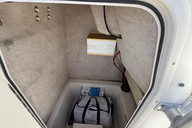 Slide: The Image of Storage compartment of 2006 Hydra-Sports Lightning 212 CC boat with gear and equipment. - 44