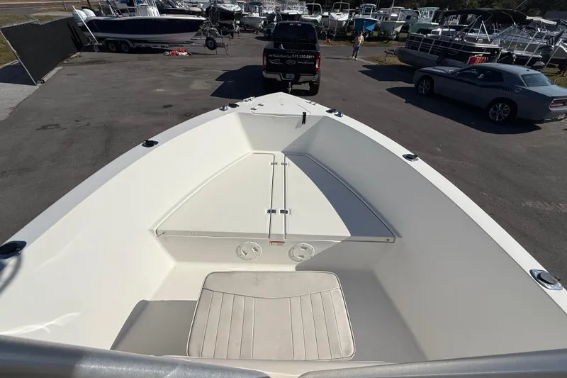 Slide: The Image of 2006 Hydra-Sports Lightning 212 CC boat in a marina, viewed from the bow. - 46