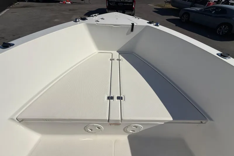 Slide: The Image of 2006 Hydra-Sports Lightning 212 CC boat deck, featuring spacious storage compartments. - 47