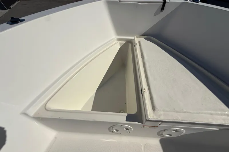 Slide: The Image of 2006 Hydra-Sports Lightning 212 CC boat storage compartment, open and empty. - 49