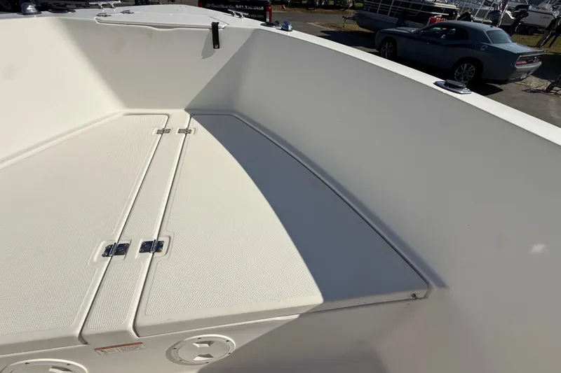 Slide: The Image of 2006 Hydra-Sports Lightning 212 CC boat deck with storage compartments. - 50