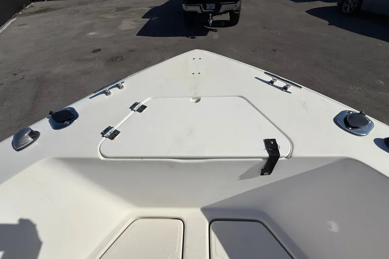Slide: The Image of 2006 Hydra-Sports Lightning 212 CC boat deck with storage hatch and fittings. - 52