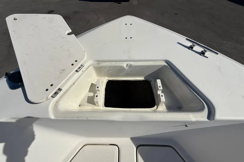 Slide: The Image of Open storage compartment on 2006 Hydra-Sports Lightning 212 CC boat. - 53
