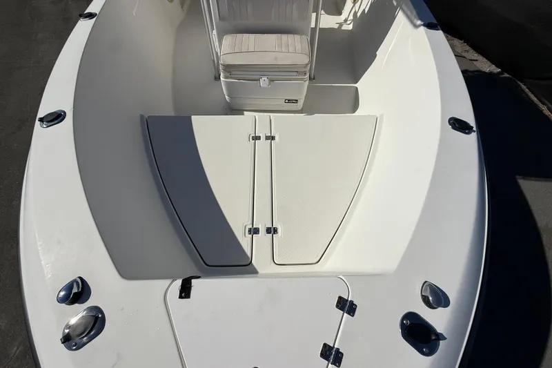 Slide: The Image of 2006 Hydra-Sports Lightning 212 CC boat deck with seating and storage compartments. - 54