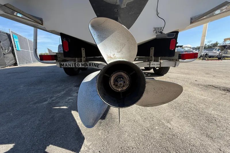 Slide: The Image of 2006 Hydra-Sports Lightning 212 CC boat propeller and trailer at marina. - 6