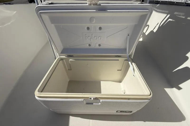 Slide: The Image of Open Igloo cooler on 2006 Hydra-Sports Lightning 212 CC boat deck. - 60