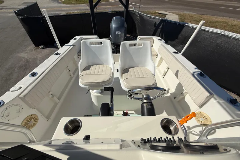 Slide: The Image of 2006 Hydra-Sports Lightning 212 CC boat interior with seating and steering wheel. - 62