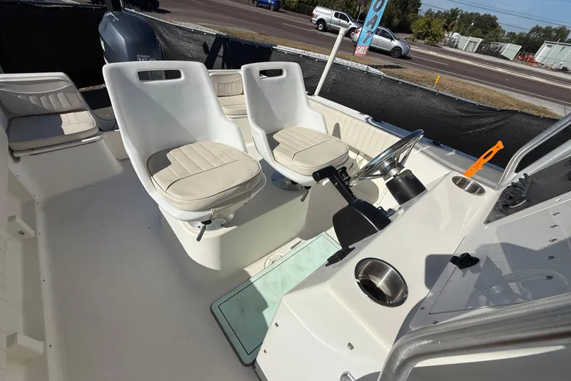 Slide: The Image of 2006 Hydra-Sports Lightning 212 CC boat interior with dual seats and steering console. - 63