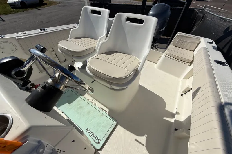 Slide: The Image of 2006 Hydra-Sports Lightning 212 CC boat interior with steering wheel and seating. - 64