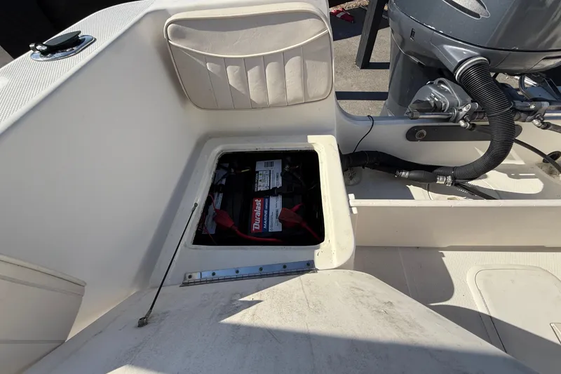 Slide: The Image of 2006 Hydra-Sports Lightning 212 CC boat battery compartment with visible wiring. - 69