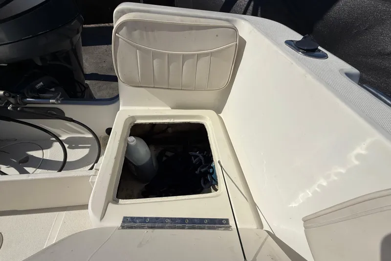 Slide: The Image of 2006 Hydra-Sports Lightning 212 CC boat storage compartment with open lid. - 72