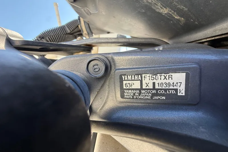 Slide: The Image of Close-up of Yamaha F150TXR engine label on 2006 Hydra-Sports Lightning 212 CC boat. - 77