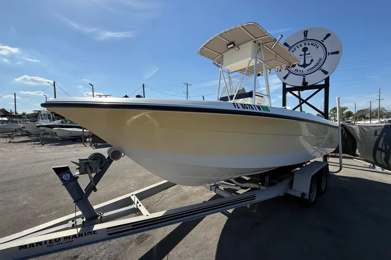 Slide: The Image of 2006 Hydra-Sports Lightning 212 CC boat on trailer under clear blue sky. - 9