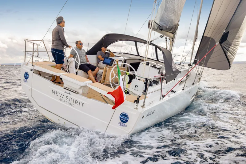 Slide: The Image of 2026 Hanse 360 sailboat "New Spirit" sailing with crew on open sea. - 14