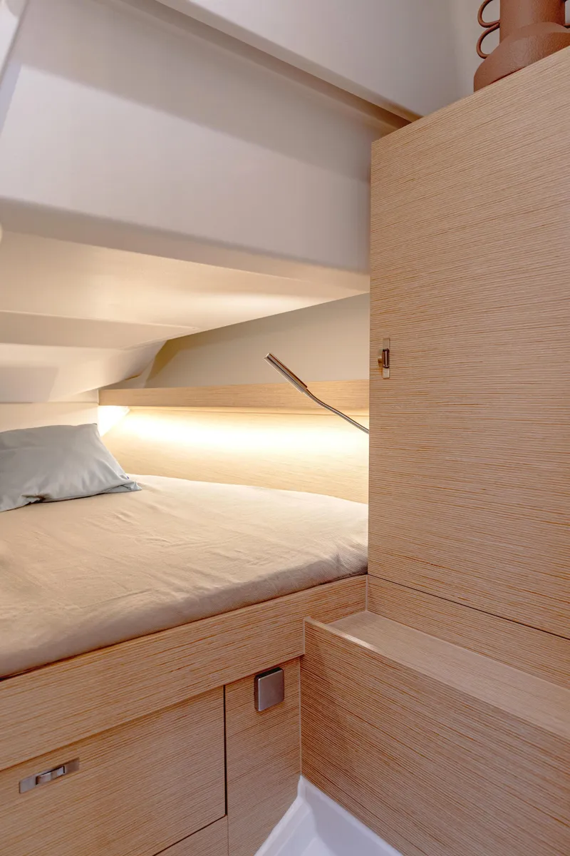 Slide: The Image of Interior of 2025 Hanse 360 #41 yacht, featuring a cozy cabin with modern wood finish. - 29