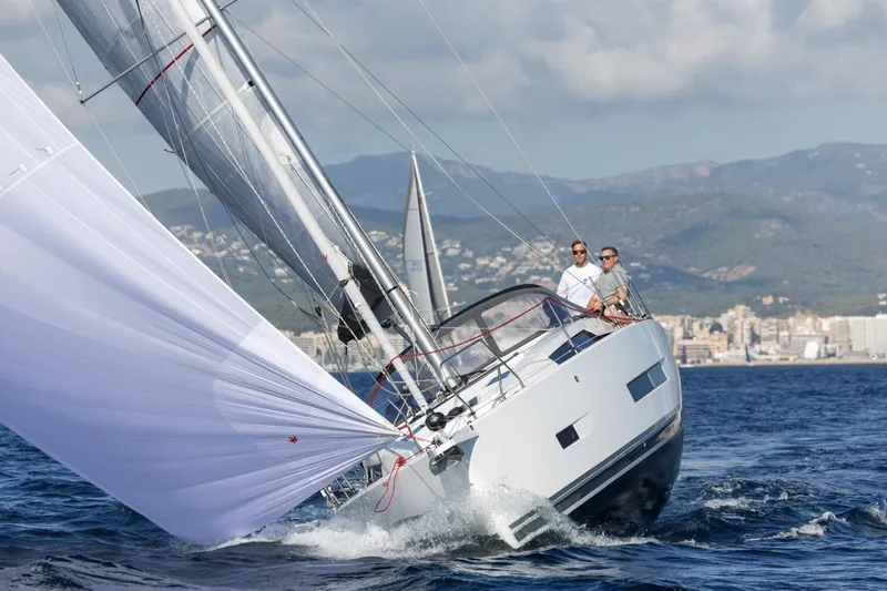 Slide: The Image of 2026 Hanse 360 sailboat navigating ocean waves with two people onboard. - 37