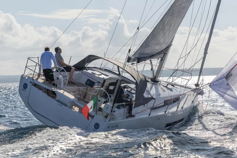 Slide: The Image of 2026 Hanse 360 sailboat navigating ocean waves under clear skies. - 38