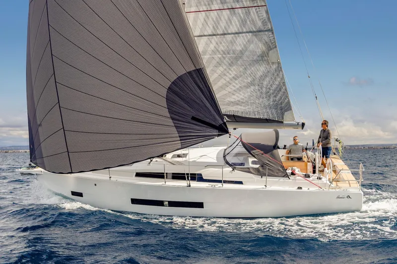 Slide: The Image of 2026 Hanse 360 sailboat navigating ocean waters with two people onboard. - 4