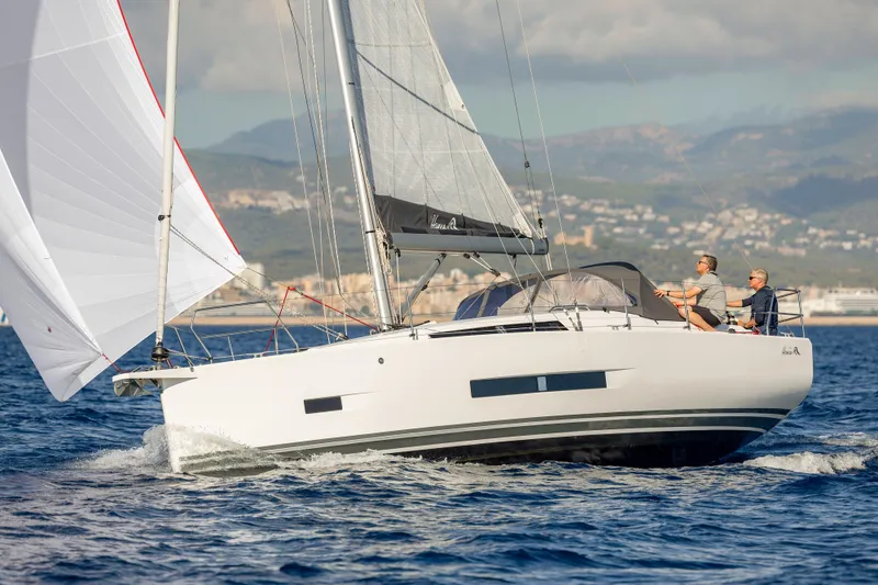 Slide: The Image of 2026 Hanse 360 sailboat cruising on open water with two people onboard. - 7