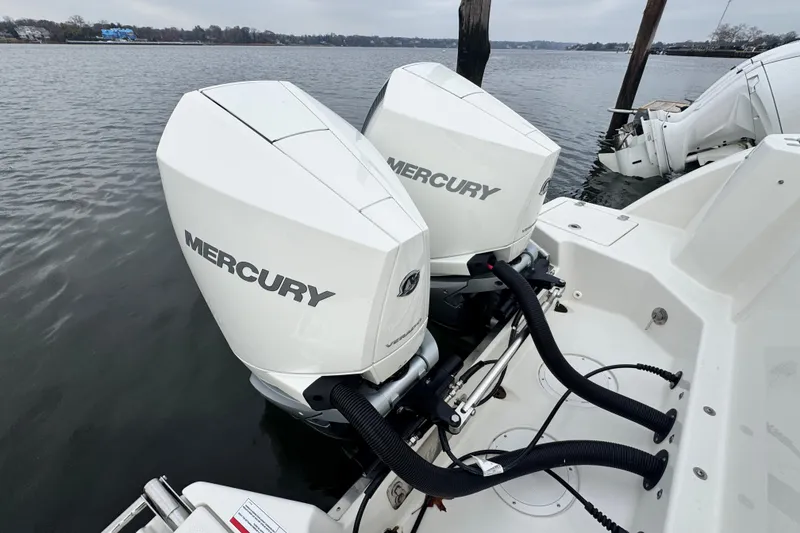 Slide: The Image of Luxurious seating on 2025 Sailfish 276 DC boat, featuring cup holders and elegant design. - 12