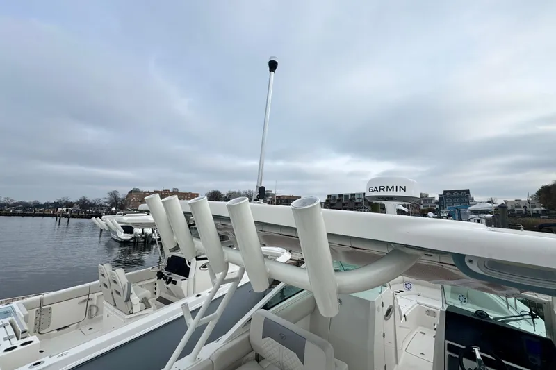 Slide: The Image of Bow area of 2025 Sailfish 276 DC boat with anchor and storage compartments. - 13