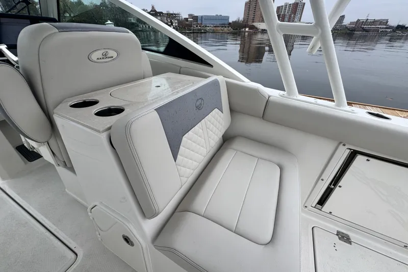Slide: The Image of 2025 Sailfish 276 DC boat dashboard with advanced Garmin navigation displays. - 7