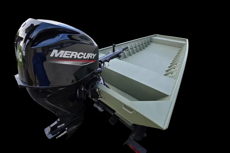 Slide: The Image of 2025 Weldcraft 1752-CL boat on trailer, parked on gravel near a beige building. - 2