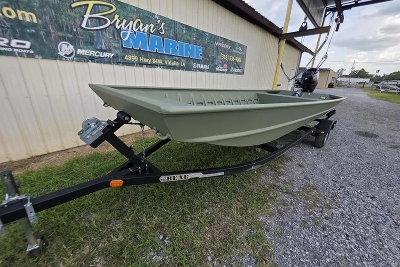 Slide: The Image of 2025 Weldcraft 1752-CL boat on trailer, parked on gravel near a beige building. - 5