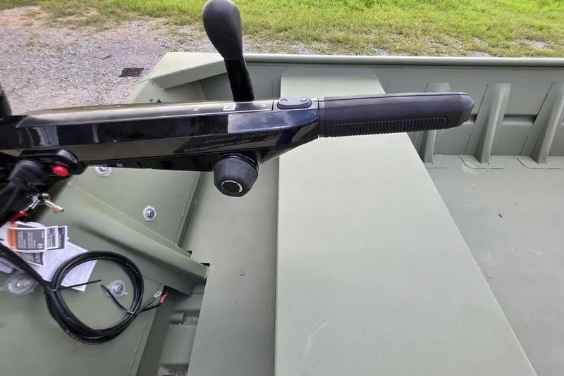 Slide: The Image of Interior of 2025 Weldcraft 1752-CL boat showing floor details and drain. - 8