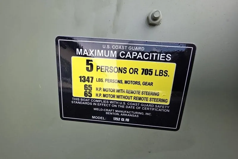 Slide: The Image of 2025 Weldcraft 1752-CL boat deck with storage compartment and mounting plate. - 9