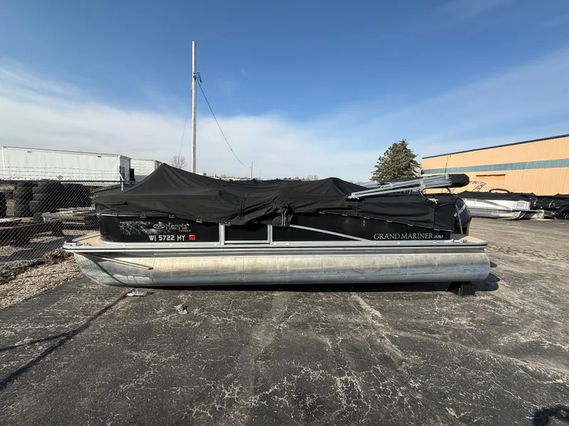 Slide: The Image of 2012 Harris Grand Mariner 230 pontoon boat with cover on parking lot. - 10