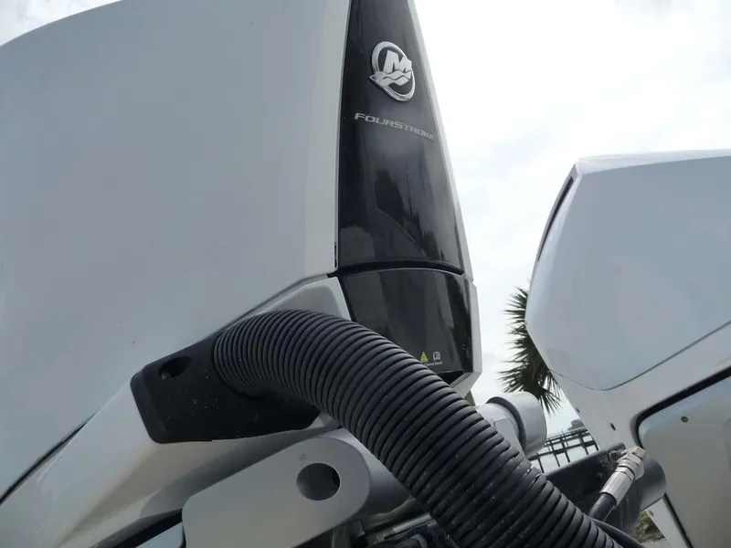 Slide: The Image of Close-up of 1985 Wellcraft Scarab 34 outboard motor, featuring Mercury branding. - 12